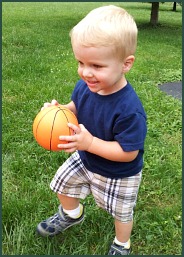Brandon and Jen's son with tiny basketball