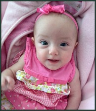 Casey and April's adopted baby girl all dressed in pink