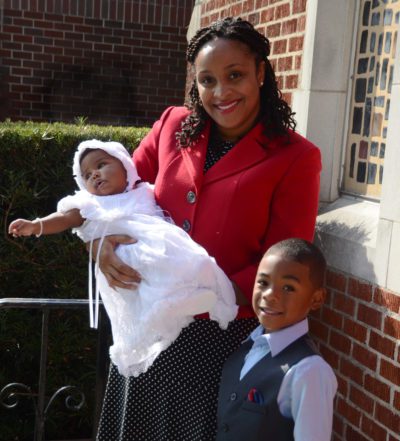 Mom in red blazer with son and adopted baby girl