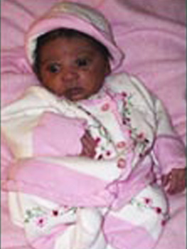 Alford and Aisha's baby dressed in pink