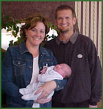 Adoptive parents Dave and Lori with their adopted newborn