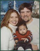Adoptive parents Joey and Tonya with their baby boy