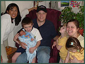Adoptive parents Nathan and Kim with their children and an adoption coordinator