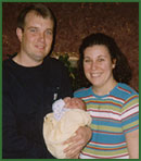 Phillip and Christy holding brand new adopted baby