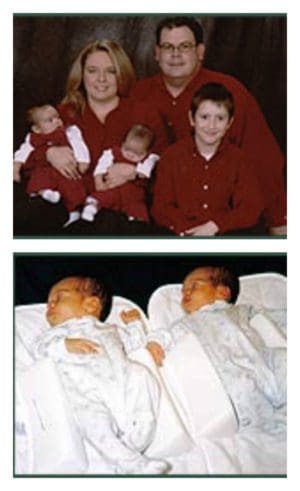 Family wearing matching red shirts holding new twins