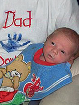 newborn baby dressed in blue