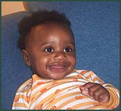 Lifetime baby Charlie smiling with a wide grin
