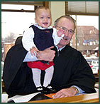 Adoptee Mikayla poses with the judge after her adoption finalization