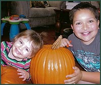Smiling kids with pumpkins