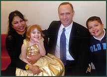 Adoptive parents Sonia Maria and Gary and their two children