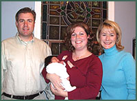 Lifetime Adoption coordinator with couple and baby