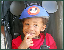 boy with Mickey Mouse ears on