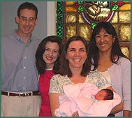 adoptive parents and baby with Lifetime staff