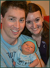 Happy adoptive parents Josh and Laci with their baby