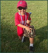 Adopted boy with baseball uniform, bat and glove