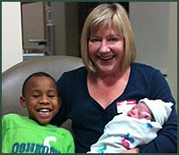Mom with African American son and newly adopted baby