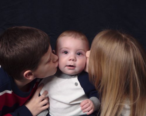 Adoptee Killian gets kisses from his brother and sister