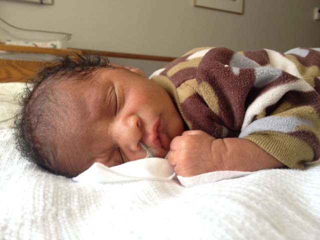 Baby boy in the hospital with a feeding tube