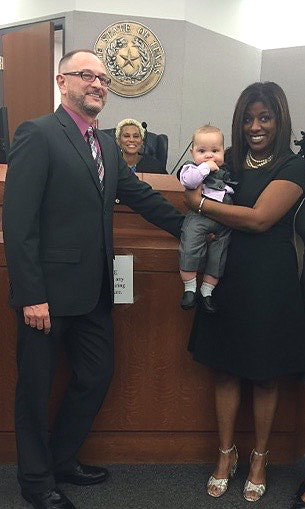 Adoptive parents Jeff and Cindy with their son at adoption finalization