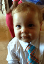 Caucasian toddler boy dressed in a tie