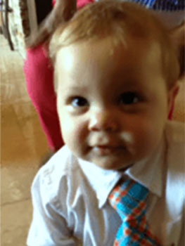 Caucasian toddler boy dressed in a tie