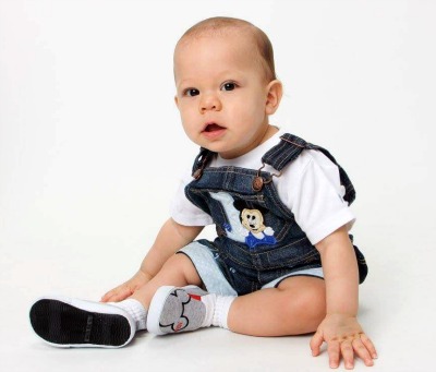 Portrait of a baby boy in overalls