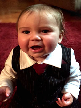 baby boy dressed in suit and tie for adoption day