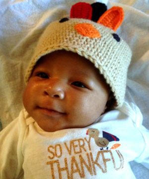 African American baby boy in a Thanksgiving onesie and hat
