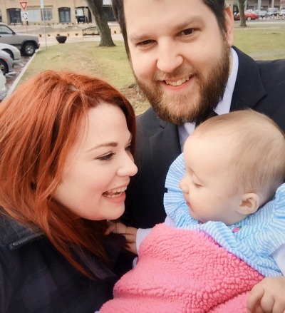 Adoptive parents Julia and Matt with their daughter