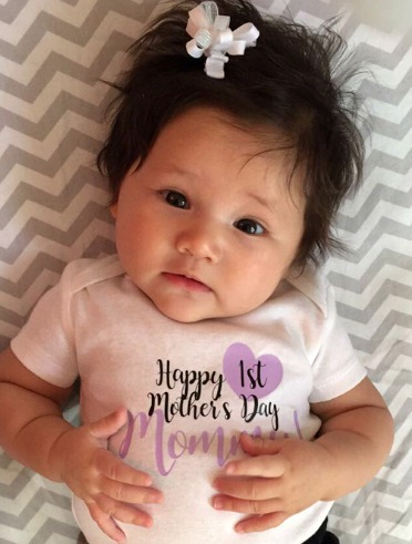 Baby girl with Happy Mothers Day onesie on