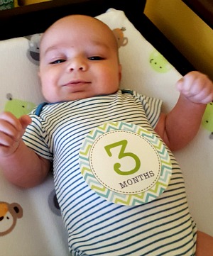 3 month old baby looking at photographer