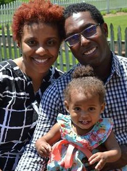 Adoptive couple Yava and Jason with their daughter