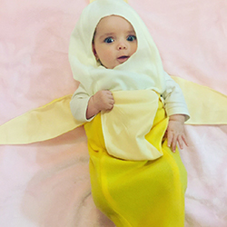 Baby dressed in a banana costume