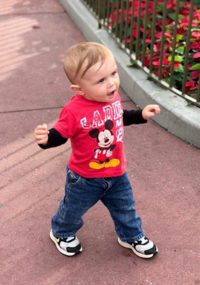 toddler walking in Disneyland