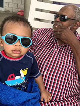 grandpa and baby hanging out with their sunglasses on