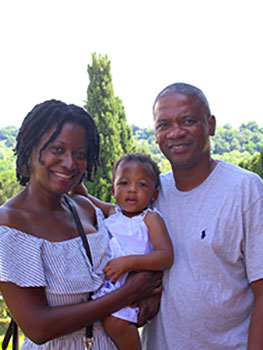 family with vineyard in background