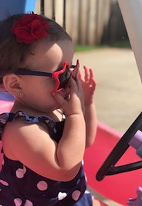 baby girl wearing star shaped sunglasses