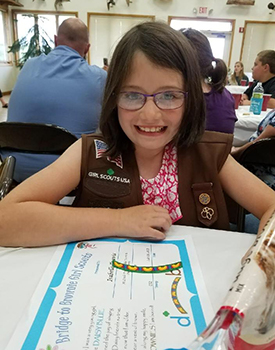 Girl scout smiling at meeting