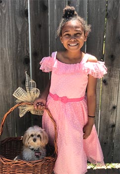 Adopted girls with dog in Easter basket