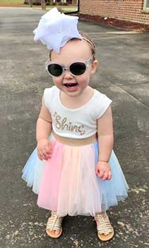 baby girl with shine shirt and skirt
