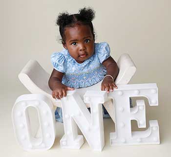 photo of a cute black one year old baby girl