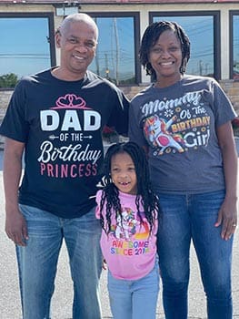 Birthday Princess smiles with her family for photo