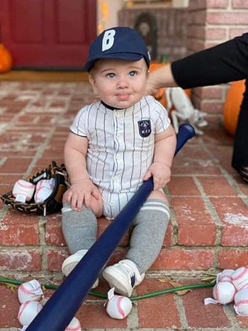 Baby dressed as a baseball player for Halloween