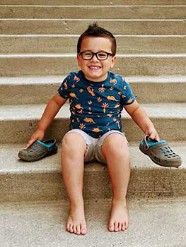 amazing young boy smiles for the camera