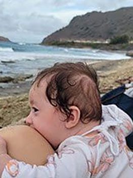 Luna at the ocean enjoying the waves