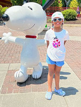 Ahava posing with Snoopy