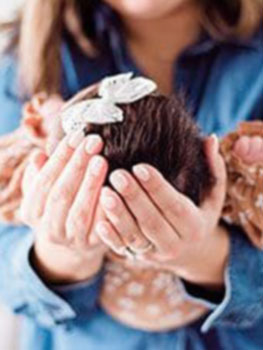 mom holding newly adopted baby