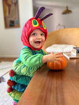 baby dresses in caterpillar costume for Halloween