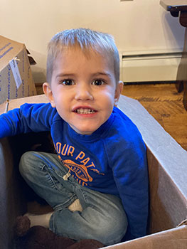 happy child playing in a box